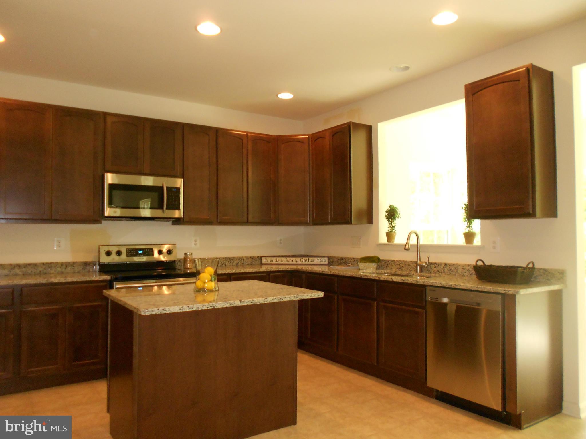 1805 Van Bibber Road Edgewood, MD 21040 - Photo 10 of 30 a kitchen with stainless steel appliances granite countertop a sink stove and microwave