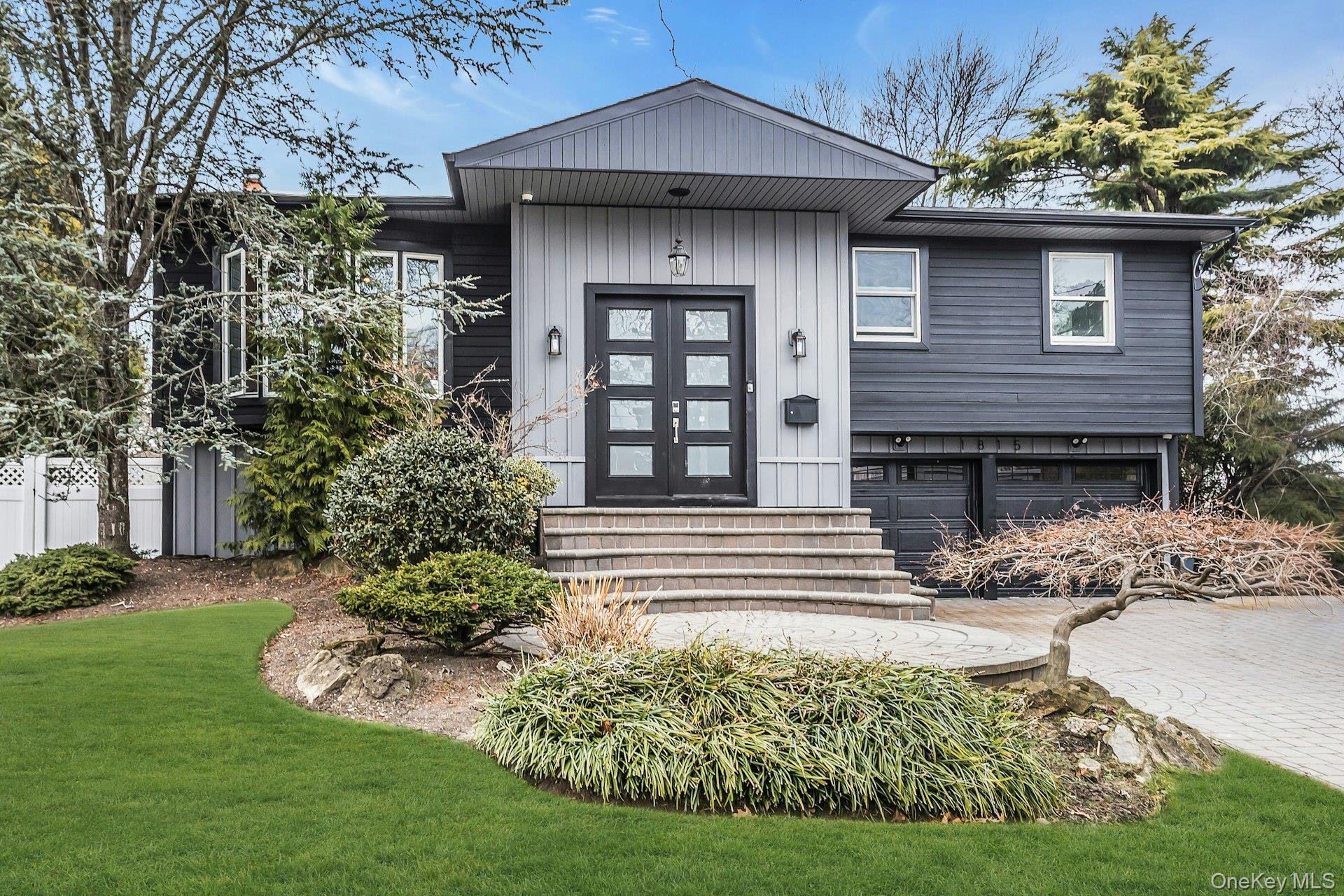 1815 Cynthia Lane Merrick, NY 11566 - Photo 1 of 1 a front view of a house with garden