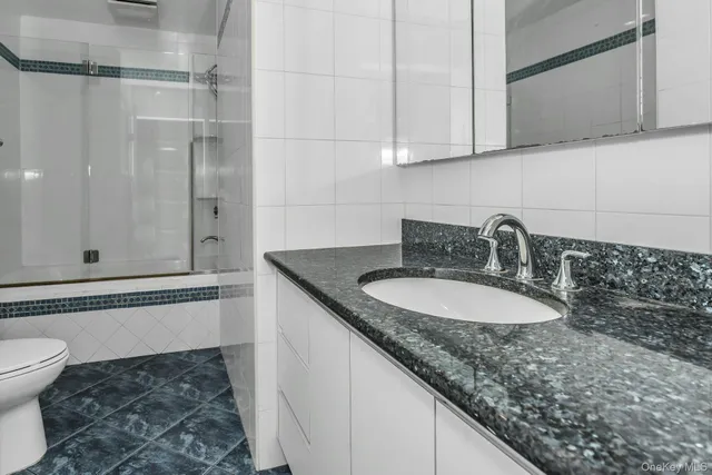 a bedroom with bed and a window