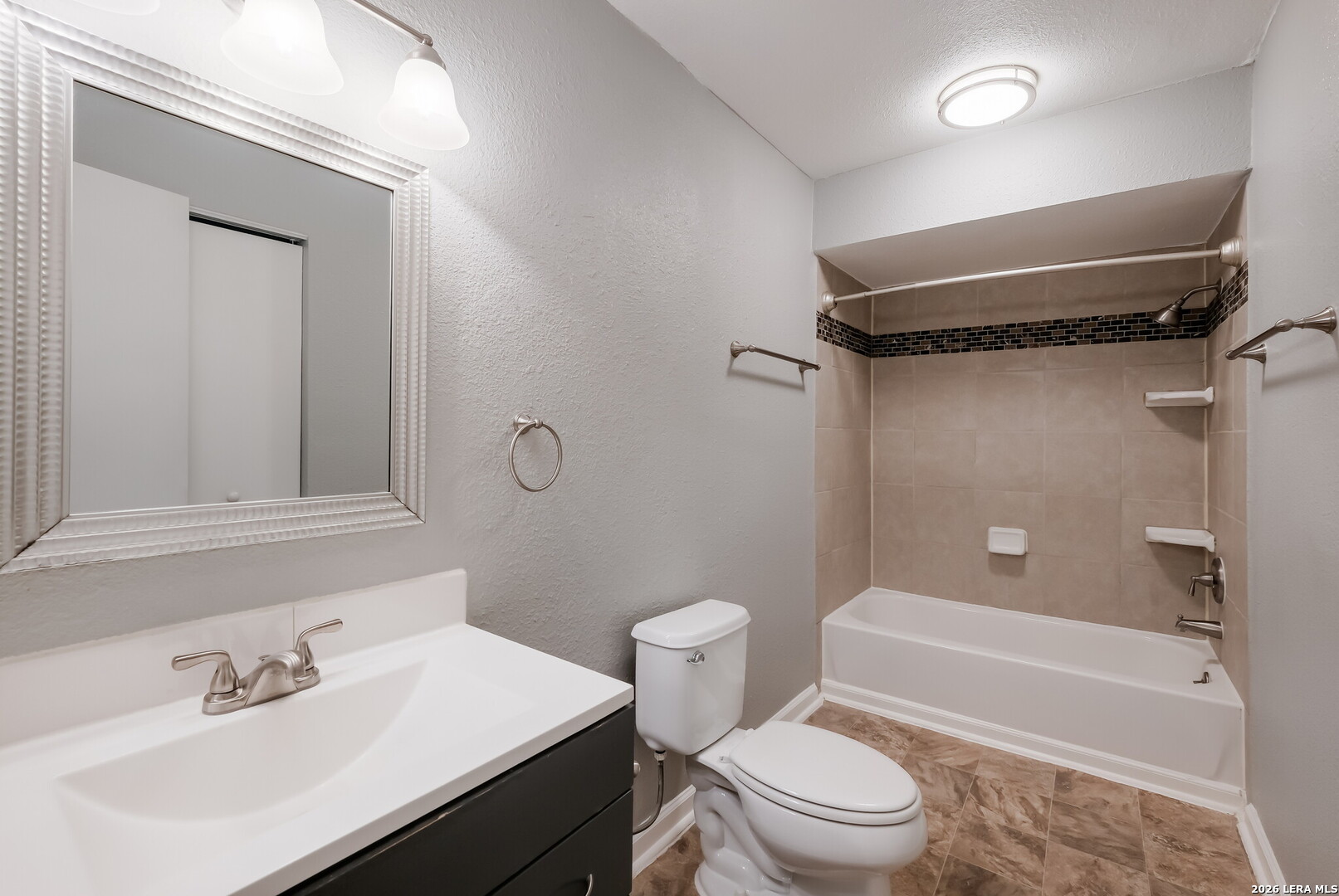 100 Lorenz Road, Unit 804 San Antonio, TX 78209 - Photo 11 of 12 a bathroom with a sink toilet and shower