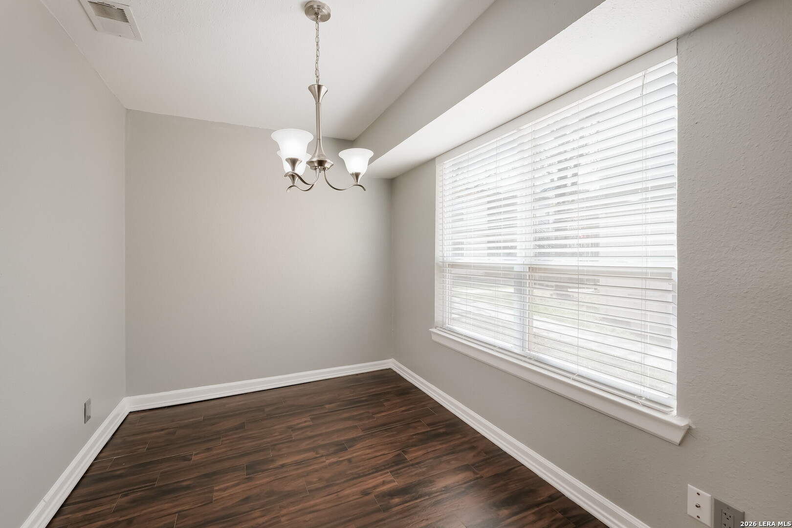 100 Lorenz Road, Unit 804 San Antonio, TX 78209 - Photo 3 of 12 a view of a room with wooden floor and a window