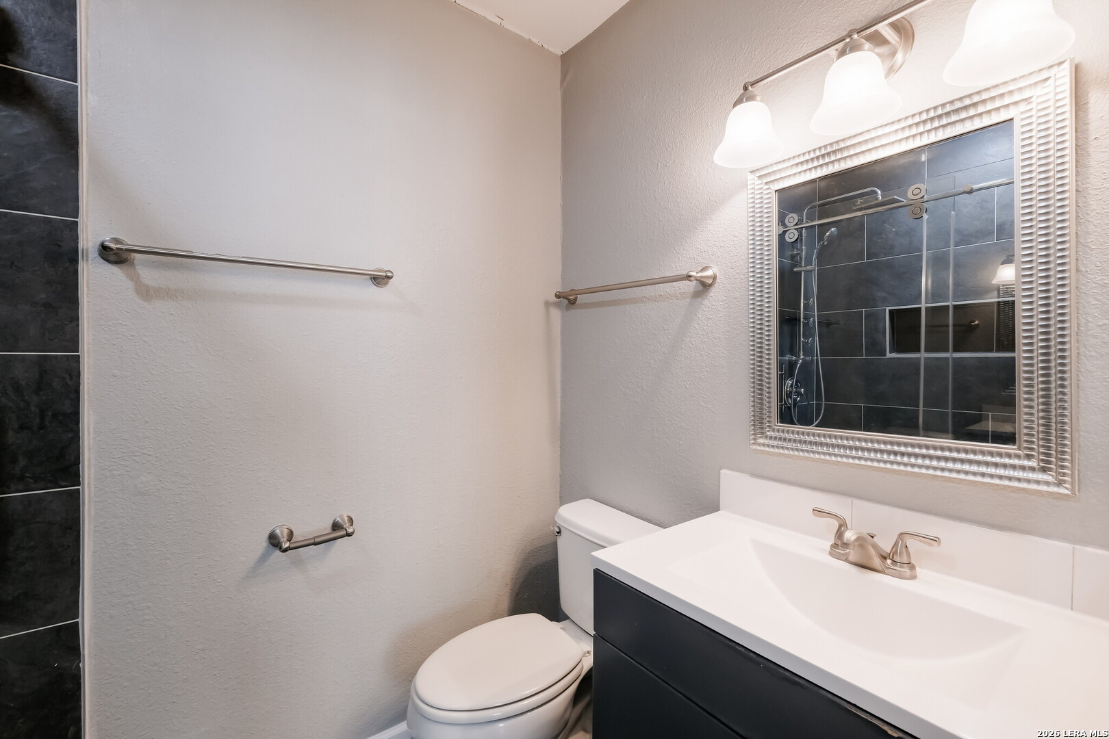 100 Lorenz Road, Unit 804 San Antonio, TX 78209 - Photo 9 of 12 a bathroom with a sink toilet and shower