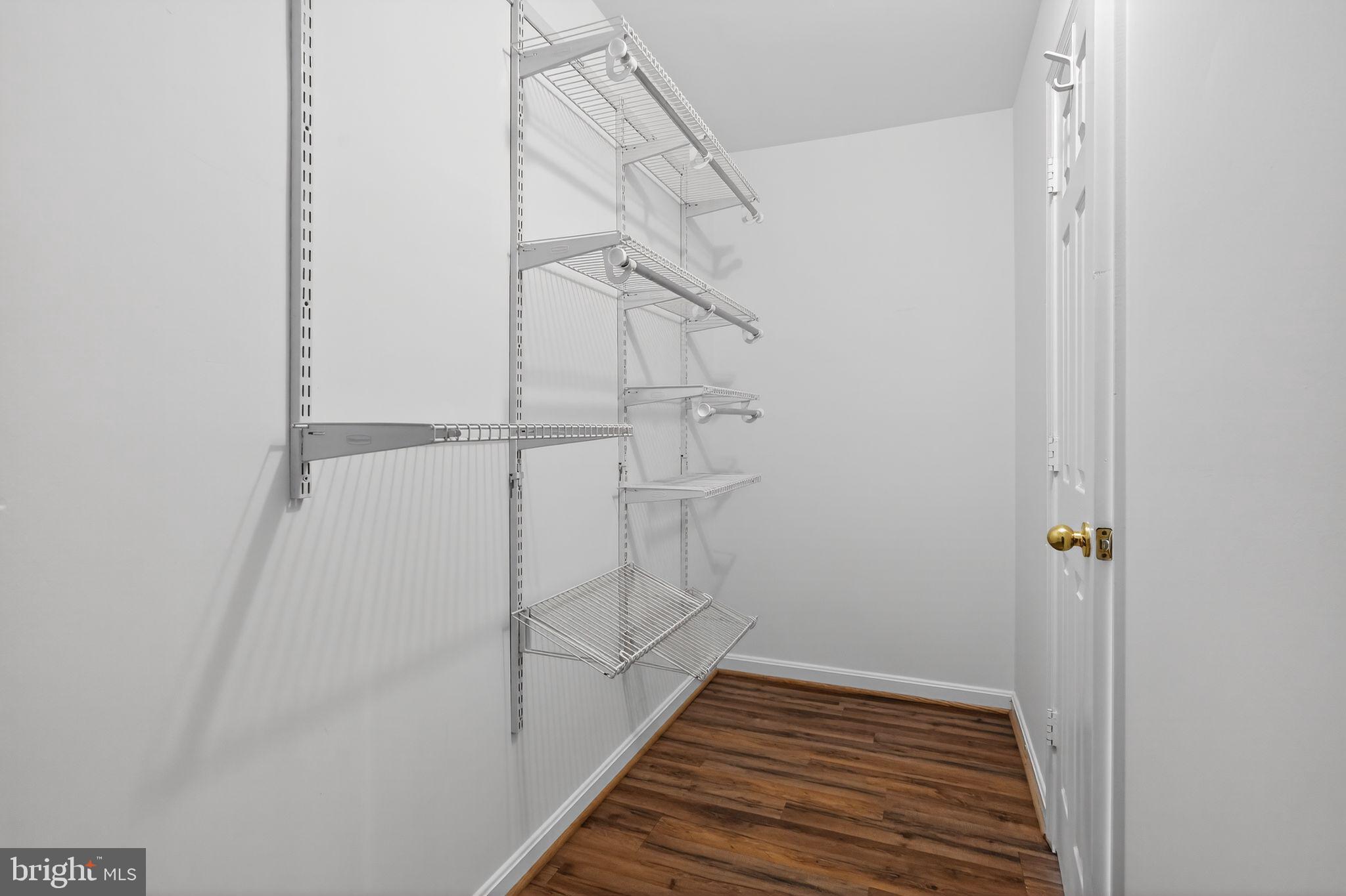 9745 Quiet Brook Lane Clinton, MD 20735 - Photo 40 of 43 a view of a room with wooden floor