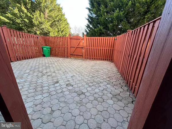 a view of outdoor space with wooden fence