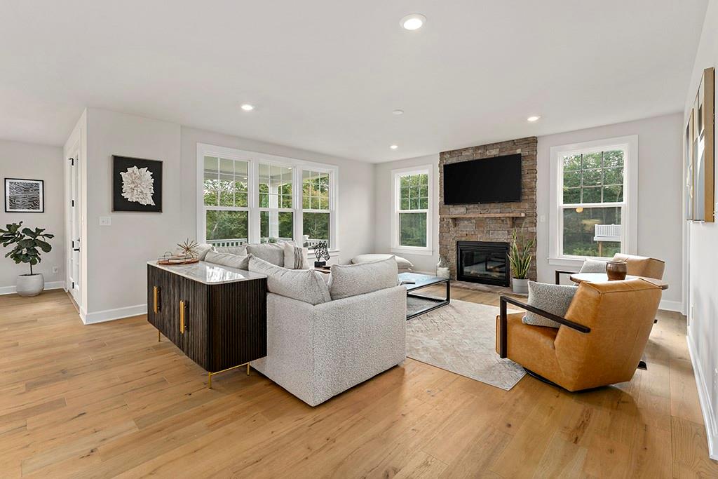 105 Abigail Drive Mars, PA 16046 - Photo 12 of 50 a living room with furniture a flat screen tv and a fireplace