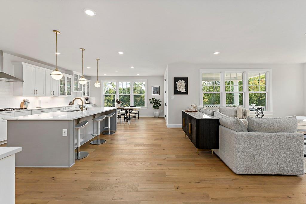 105 Abigail Drive Mars, PA 16046 - Photo 16 of 50 a living room with stainless steel appliances kitchen island granite countertop a large kitchen counter top a stove and a wooden floors