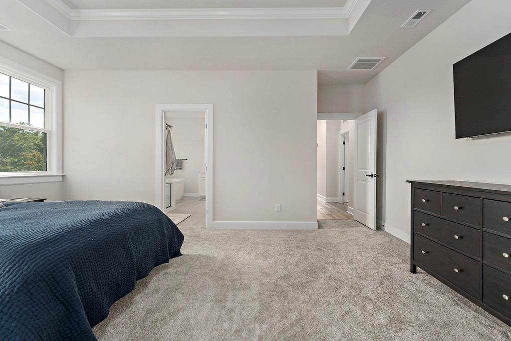 105 Abigail Drive Mars, PA 16046 - Photo 30 of 50 a bedroom with a bed and a flat screen tv