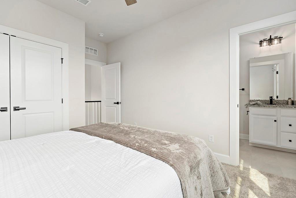 105 Abigail Drive Mars, PA 16046 - Photo 37 of 50 a bedroom with a bathroom and a sink