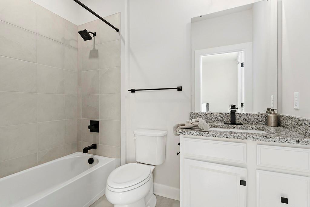 105 Abigail Drive Mars, PA 16046 - Photo 38 of 50 a bathroom with a granite countertop sink toilet and shower