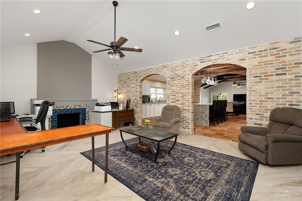 22172 North Olmito Road Rio Hondo, TX 78583 - Photo 7 of 33 a living room with furniture and a fireplace