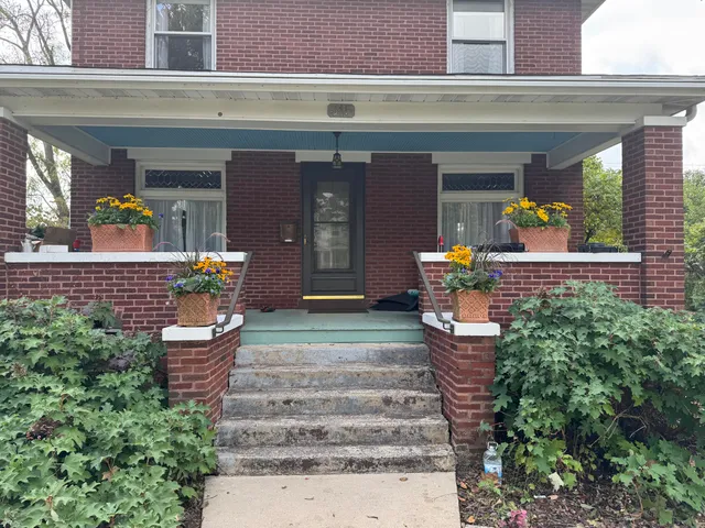 a front view of a house with a porch