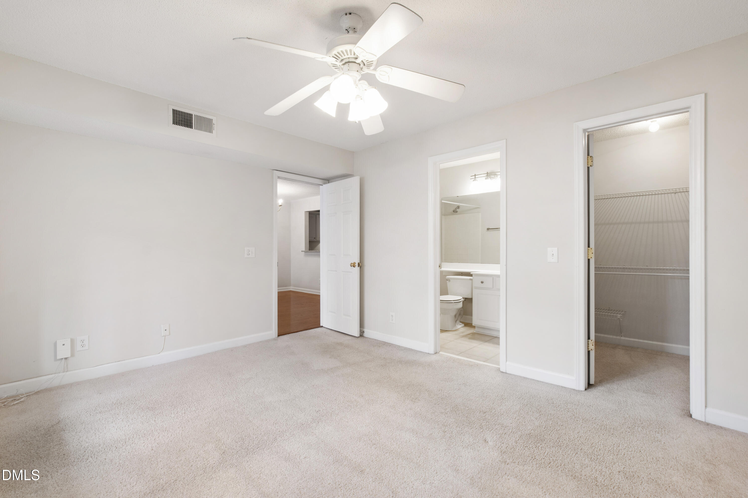 1210 Westview Lane, Unit 303 Raleigh, NC 27605 - Photo 13 of 27 wooden floor in an empty room with a bathroom