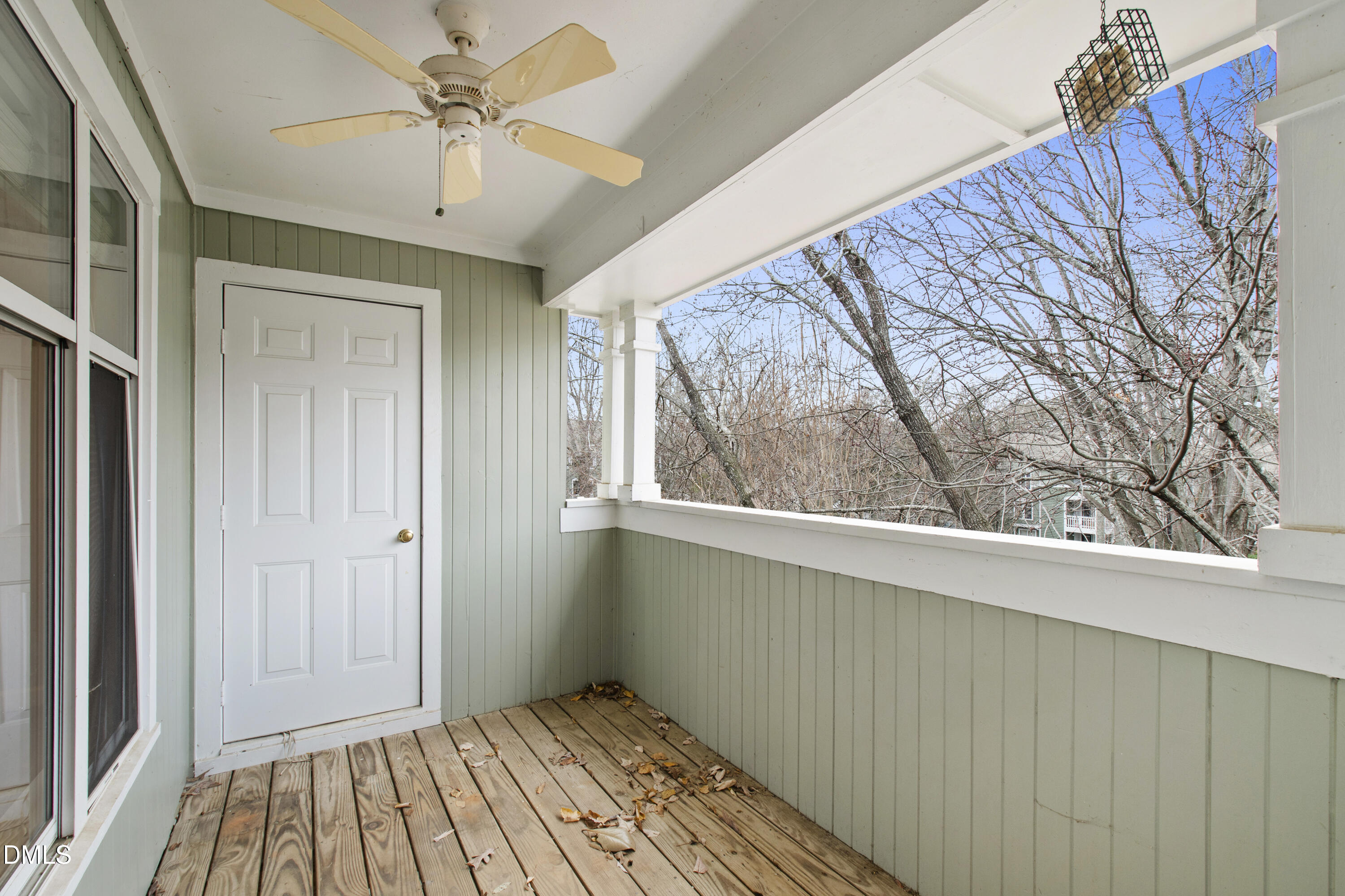 1210 Westview Lane, Unit 303 Raleigh, NC 27605 - Photo 18 of 27 a view of an empty room with a window and wooden floor