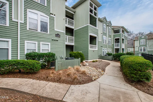 a view of a patio with a chairs and table in the patio