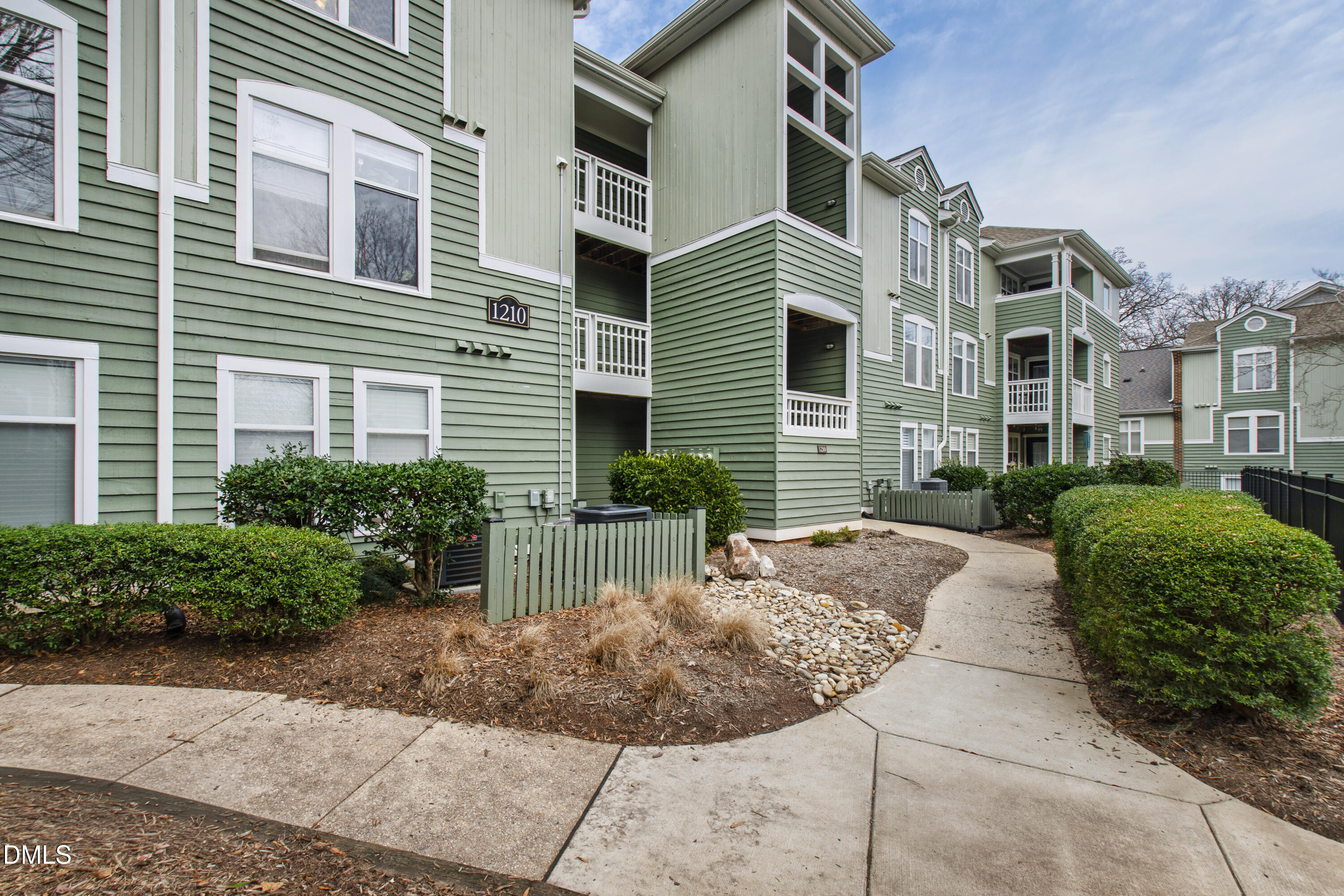 1210 Westview Lane, Unit 303 Raleigh, NC 27605 - Photo 2 of 27 a view of a patio with a chairs and table in the patio