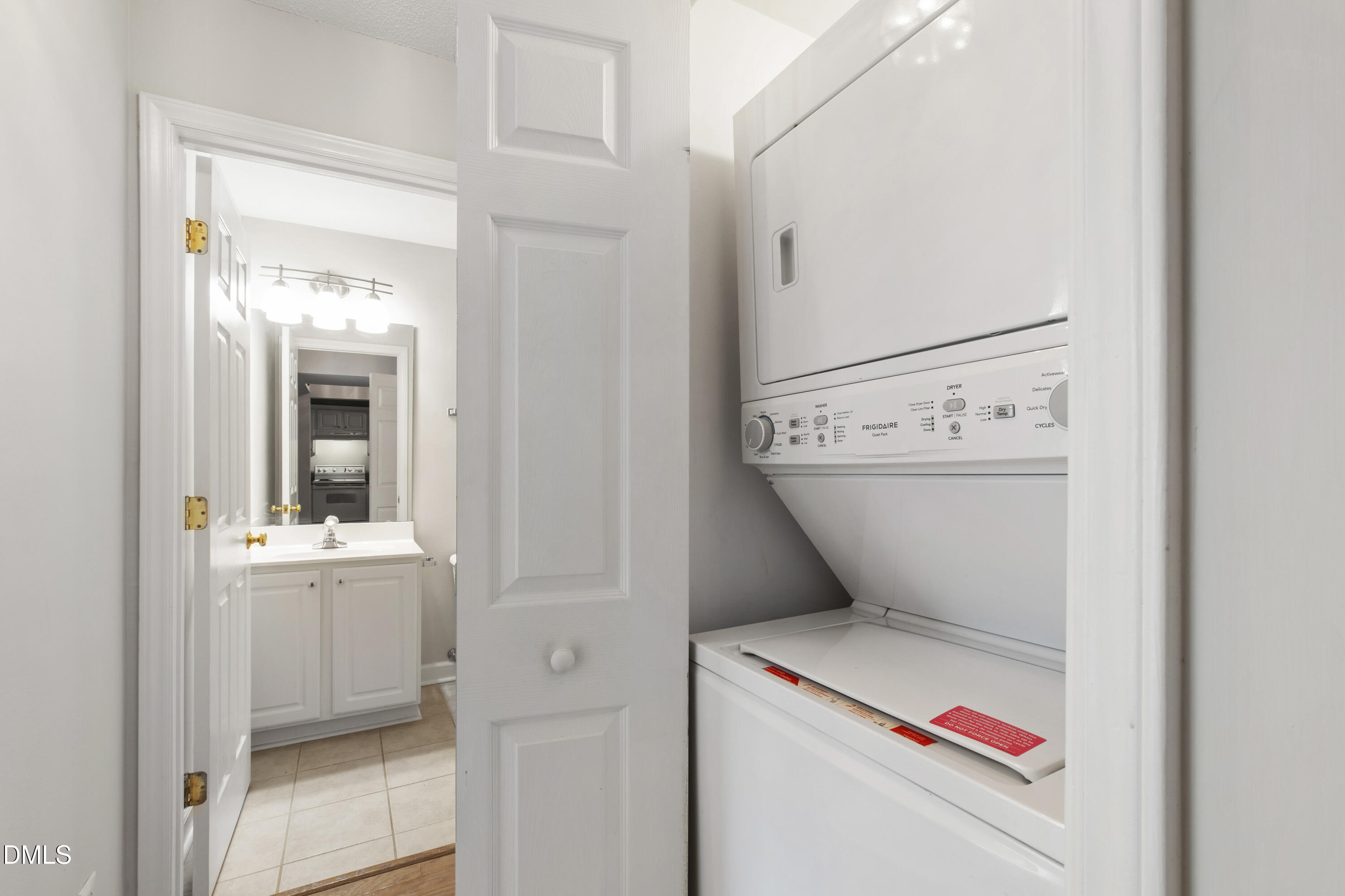 1210 Westview Lane, Unit 303 Raleigh, NC 27605 - Photo 22 of 27 a utility room with dryer and washer