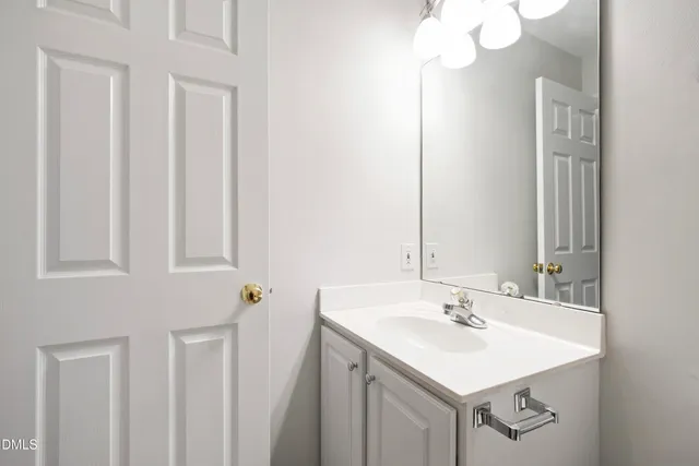 a bathroom with a sink a vanity and a mirror