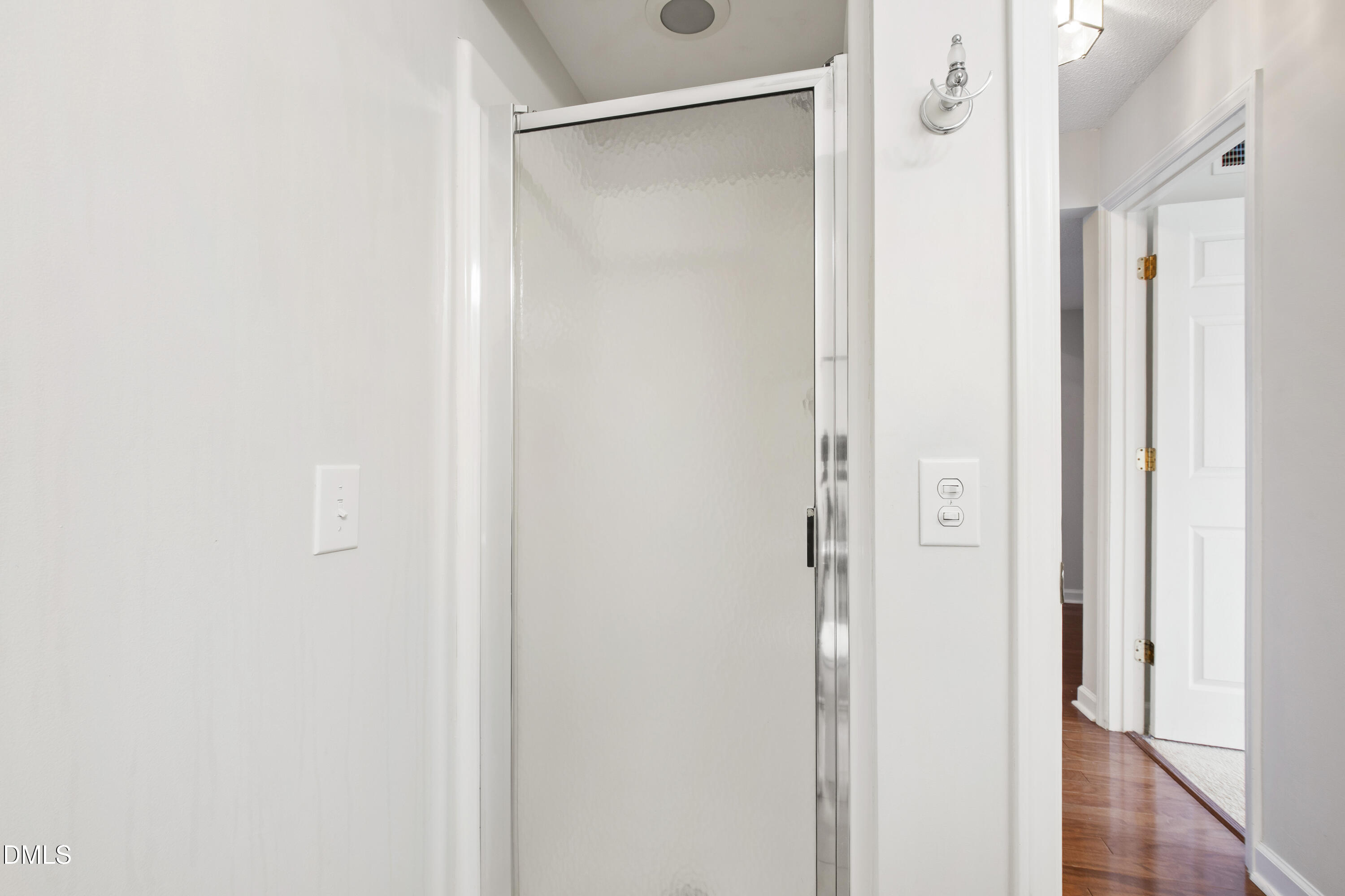 1210 Westview Lane, Unit 303 Raleigh, NC 27605 - Photo 25 of 27 a bathroom with a glass shower door