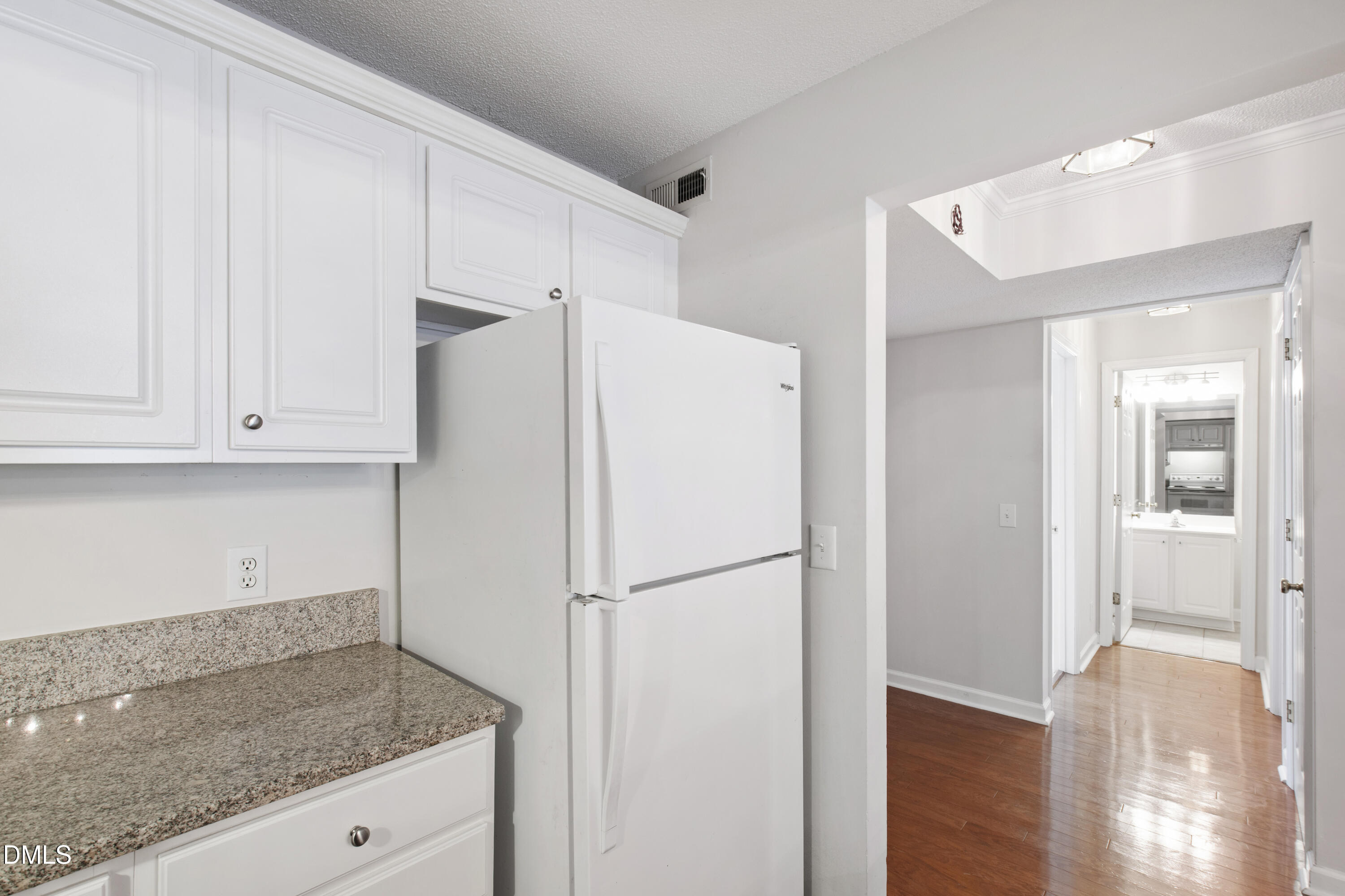1210 Westview Lane, Unit 303 Raleigh, NC 27605 - Photo 9 of 27 a white refrigerator freezer sitting inside of a kitchen