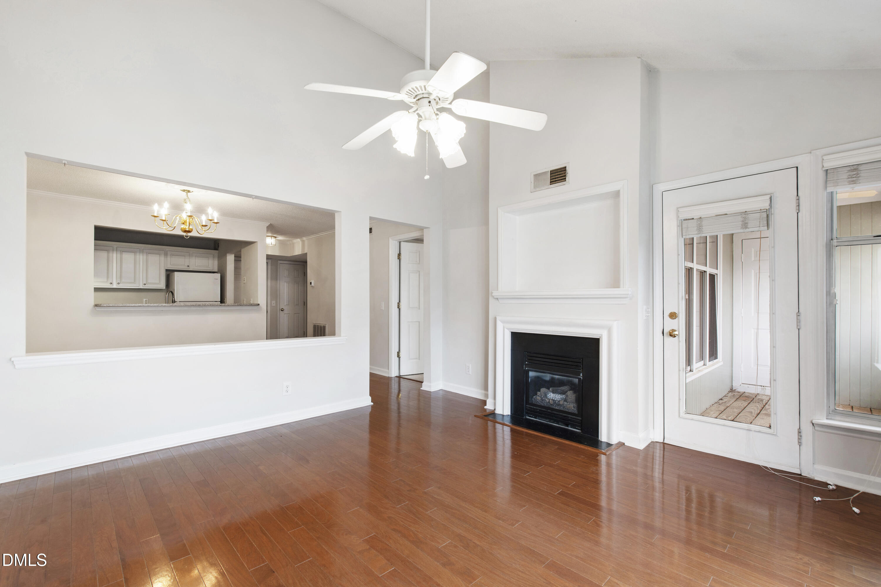 1210 Westview Lane, Unit 303 Raleigh, NC 27605 - Photo 10 of 27 a view of a livingroom with wooden floor and a fireplace