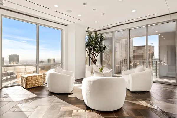 a living room with couches and a large window