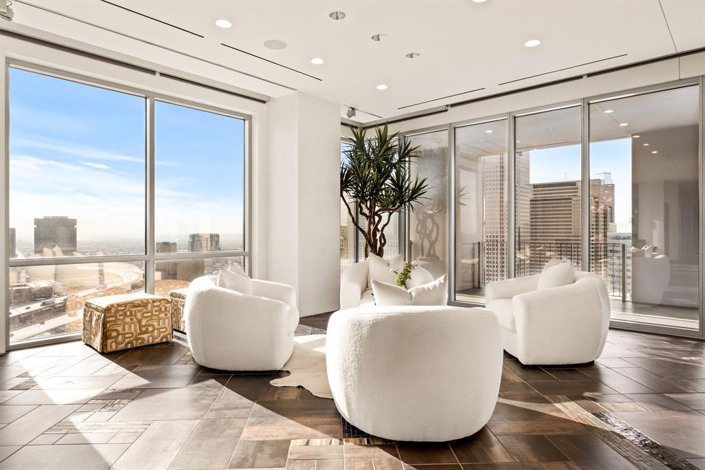 1717 Arts Plaza, Unit 2002 Dallas, TX 75201 - Photo 15 of 36 a living room with couches and a large window