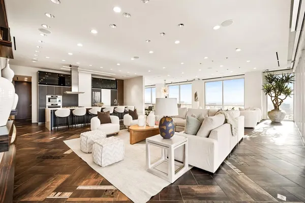 a living room with lots of furniture and a table
