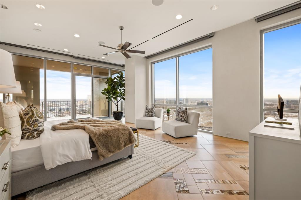 1717 Arts Plaza, Unit 2002 Dallas, TX 75201 - Photo 24 of 36 a spacious bedroom with a large bed and a large window