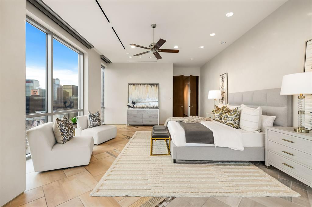 1717 Arts Plaza, Unit 2002 Dallas, TX 75201 - Photo 25 of 36 a spacious bedroom with a large bed and a couch