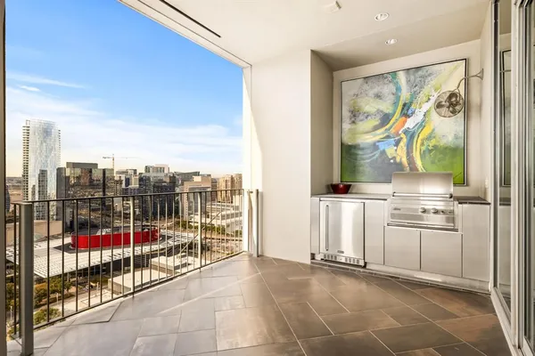 a view of a room with lots of potted plants