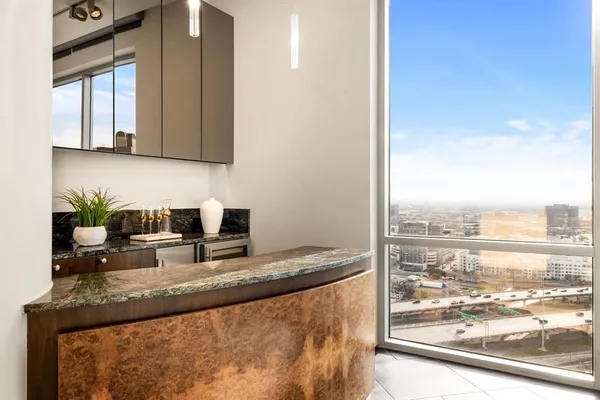 a kitchen with granite countertop a sink and a stove