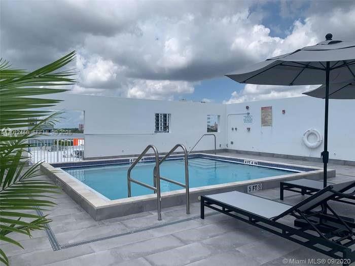 2740 Southwest 28th Terrace, Unit 203 Miami, FL 33133 - Photo 2 of 14 a outdoor space with pool table and chairs
