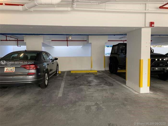 2740 Southwest 28th Terrace, Unit 203 Miami, FL 33133 - Photo 4 of 14 a view of parking garage with cars