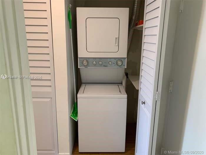 2740 Southwest 28th Terrace, Unit 203 Miami, FL 33133 - Photo 5 of 14 a utility room with dryer and washer