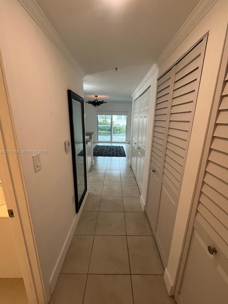 2740 Southwest 28th Terrace, Unit 203 Miami, FL 33133 - Photo 7 of 14 a hallway view with staircase