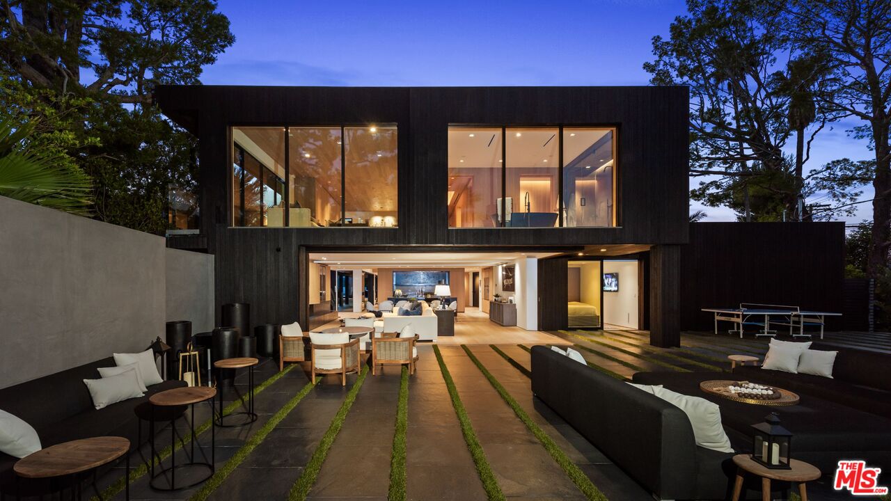 1663 Summitridge Drive Beverly Hills, CA 90210 - Photo 13 of 41 a living room with patio furniture and a fireplace