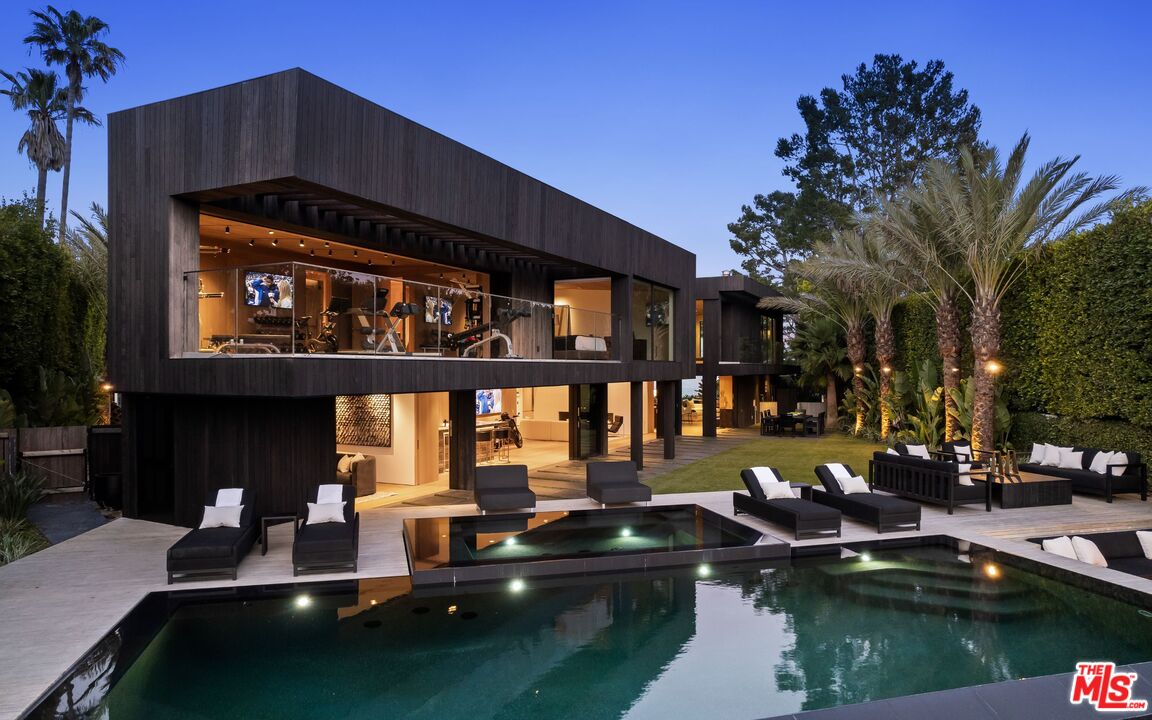 1663 Summitridge Drive Beverly Hills, CA 90210 - Photo 19 of 41 a view of pool with outdoor seating