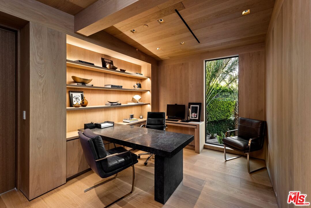 1663 Summitridge Drive Beverly Hills, CA 90210 - Photo 37 of 41 a view of a workspace with furniture and a window