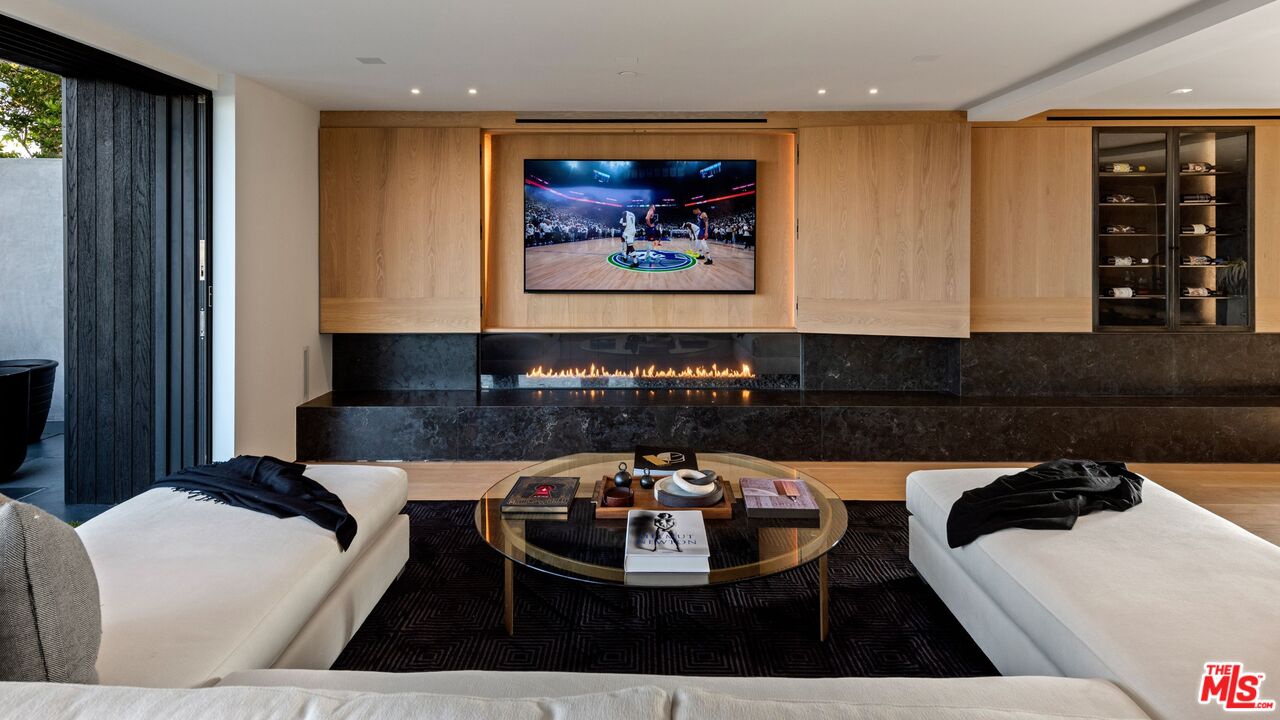 1663 Summitridge Drive Beverly Hills, CA 90210 - Photo 39 of 41 a living room with furniture and window