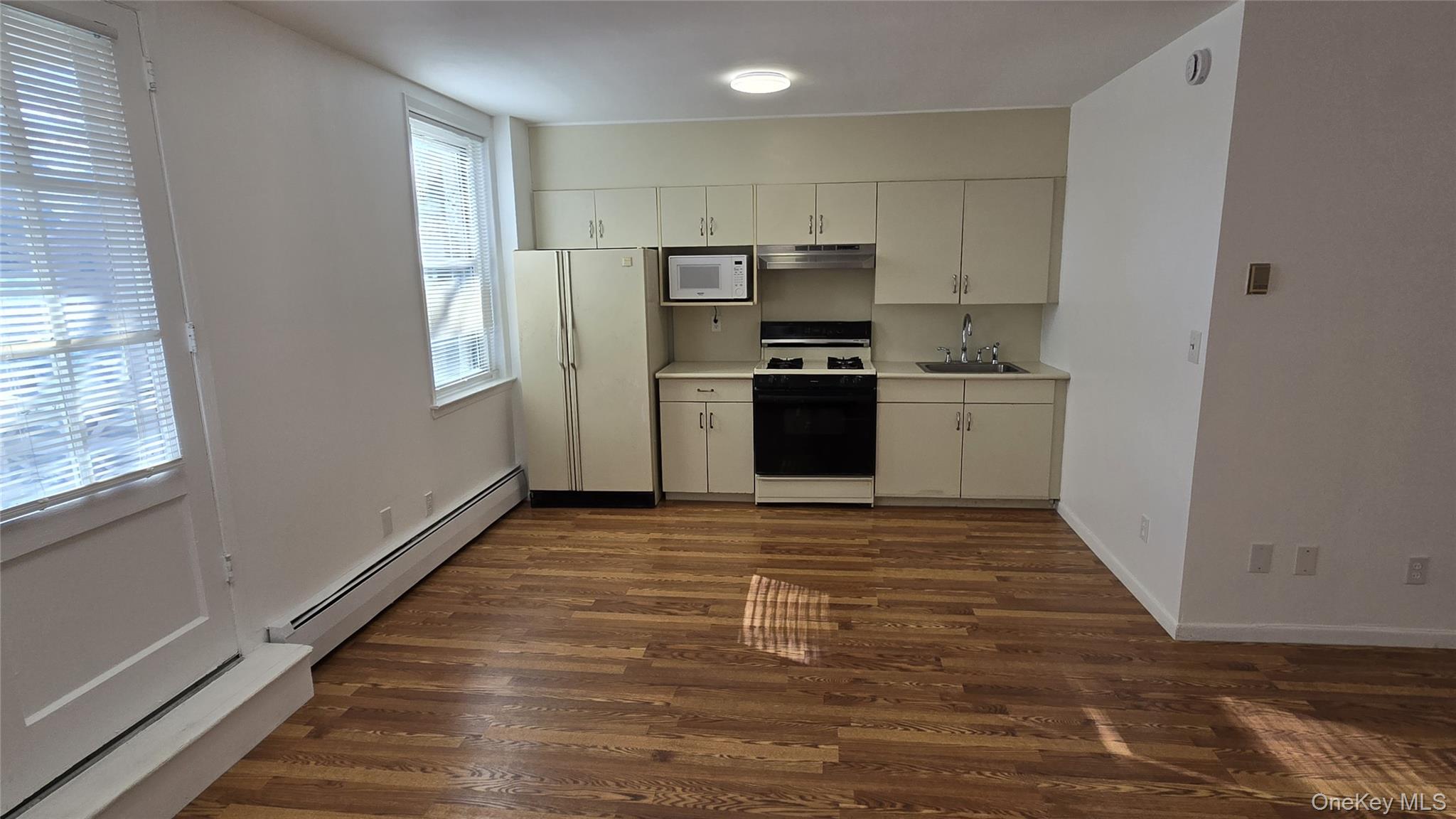 30 Daley Place, Unit 146 Lynbrook, NY 11563 - Photo 10 of 24 a kitchen with stainless steel appliances a refrigerator and a stove top oven