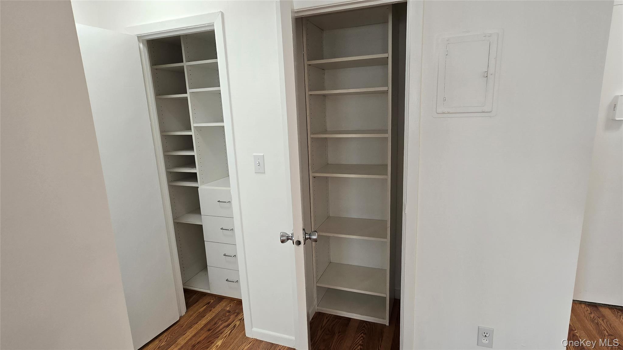 30 Daley Place, Unit 146 Lynbrook, NY 11563 - Photo 15 of 24 a view of walk in closet with empty racks