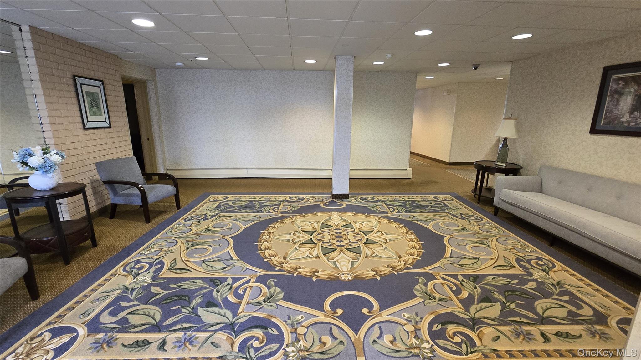 30 Daley Place, Unit 146 Lynbrook, NY 11563 - Photo 17 of 24 a living room with a rug