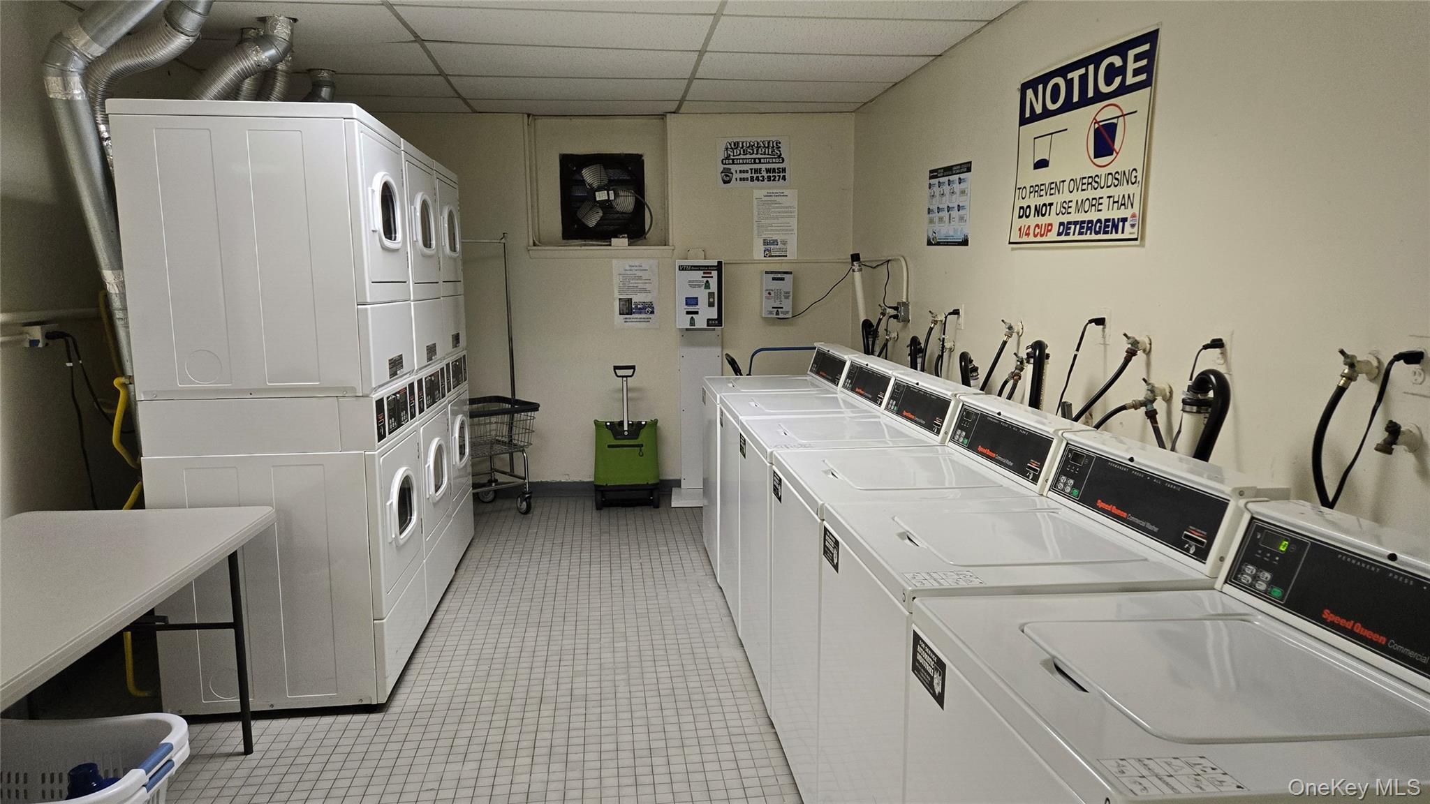 30 Daley Place, Unit 146 Lynbrook, NY 11563 - Photo 19 of 24 a utility room with multiple dryer and washer