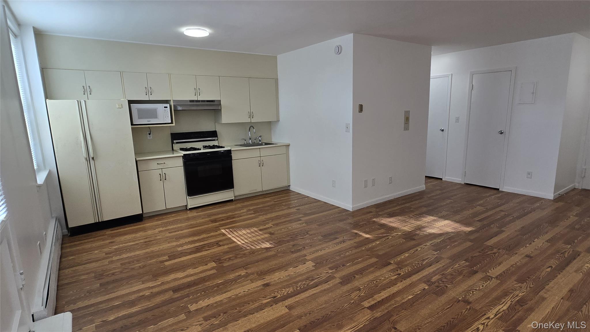 30 Daley Place, Unit 146 Lynbrook, NY 11563 - Photo 9 of 24 a kitchen with stainless steel appliances a refrigerator and a stove top oven