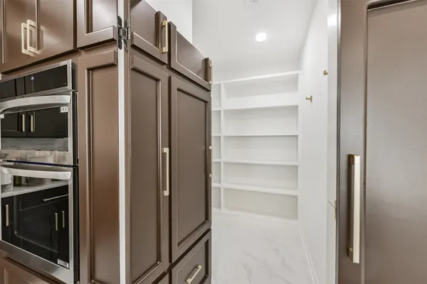 a view of a kitchen from the hallway