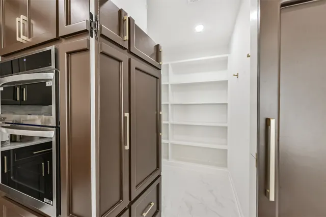 a living room with stainless steel appliances kitchen island granite countertop furniture and a kitchen view