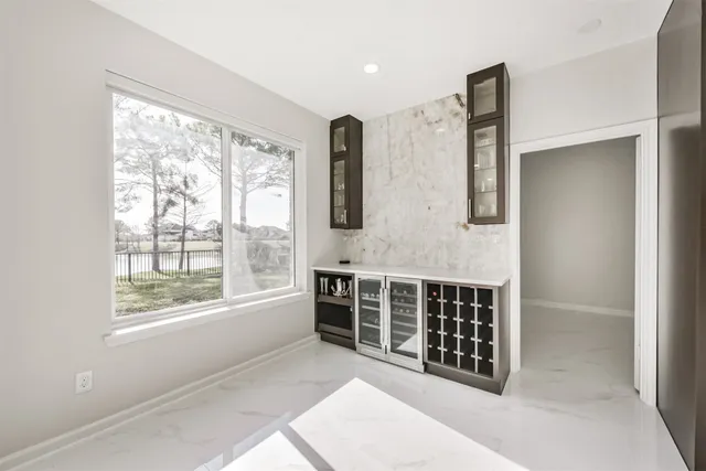 a bathroom with a double vanity sink mirror double and shower