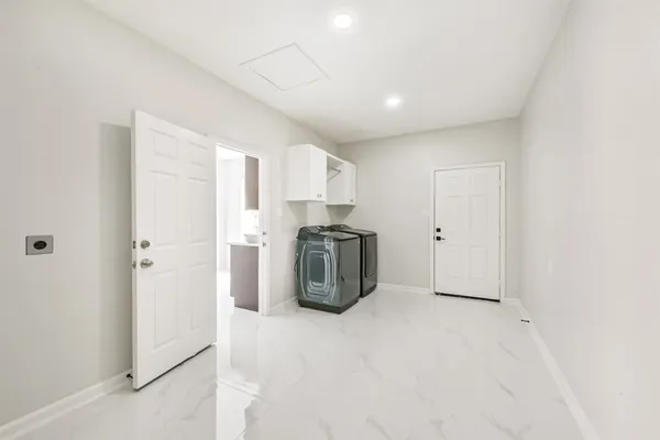 a kitchen with a refrigerator and a sink