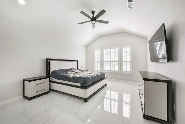 a view of an empty room and wooden floor