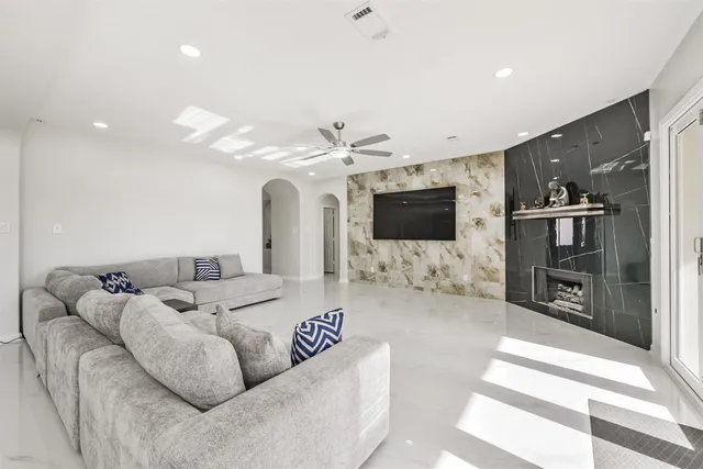 a living room with furniture and a flat screen tv